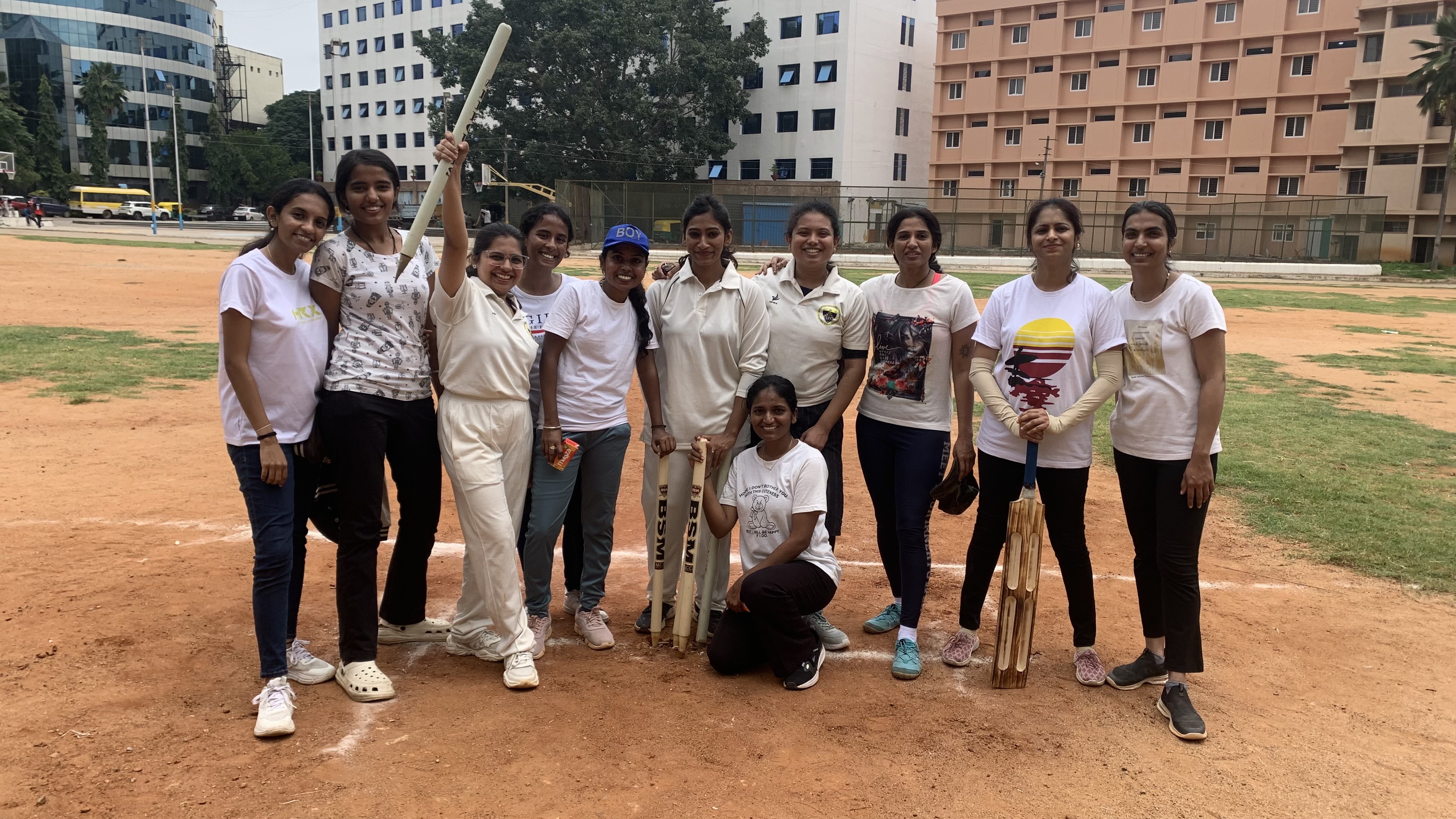 Another women's cricket team in white uniforms