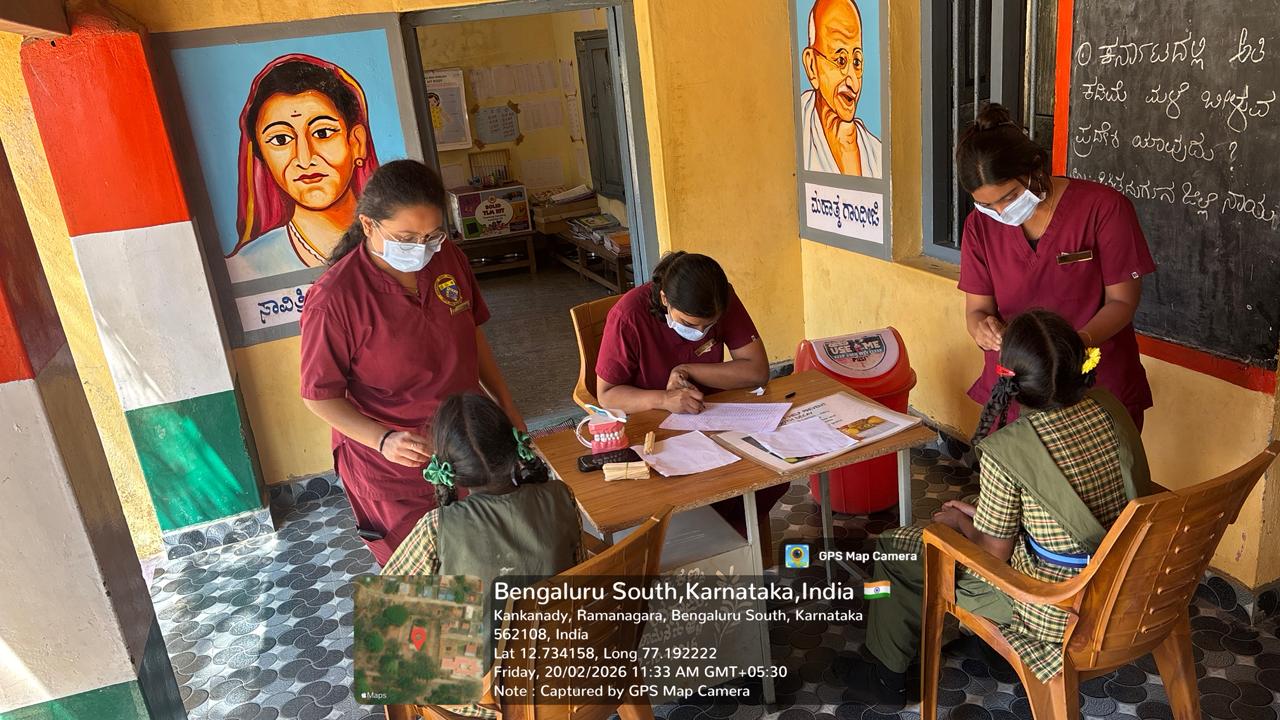 Dentist performing oral prophylaxis on a male patient