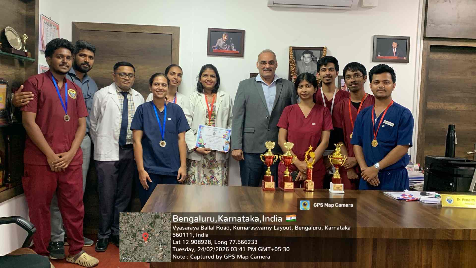 Dr. Deepak and Akivika receiving Badminton (M) Doubles Silver Medal