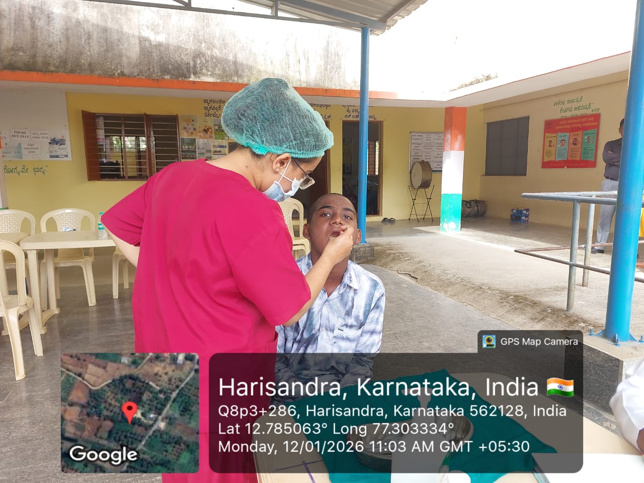 Dentist examining a patient's mouth outdoors
