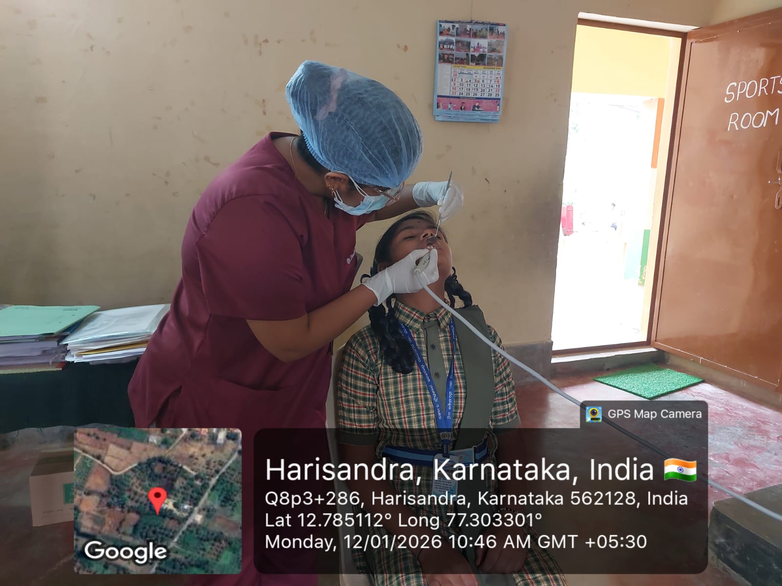 Dentist performing a dental procedure on a patient in a mobile dental unit
