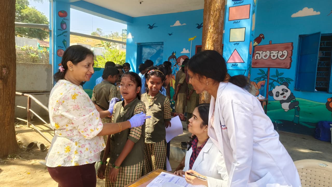 Dental screening in progress at an outdoor camp by The Oxford Dental College