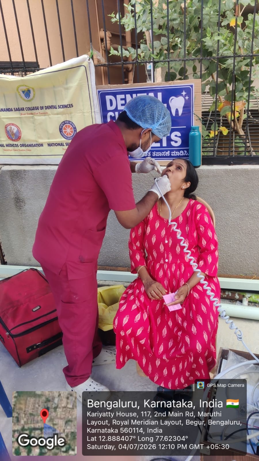 Dentist conducting an oral examination for a female patient