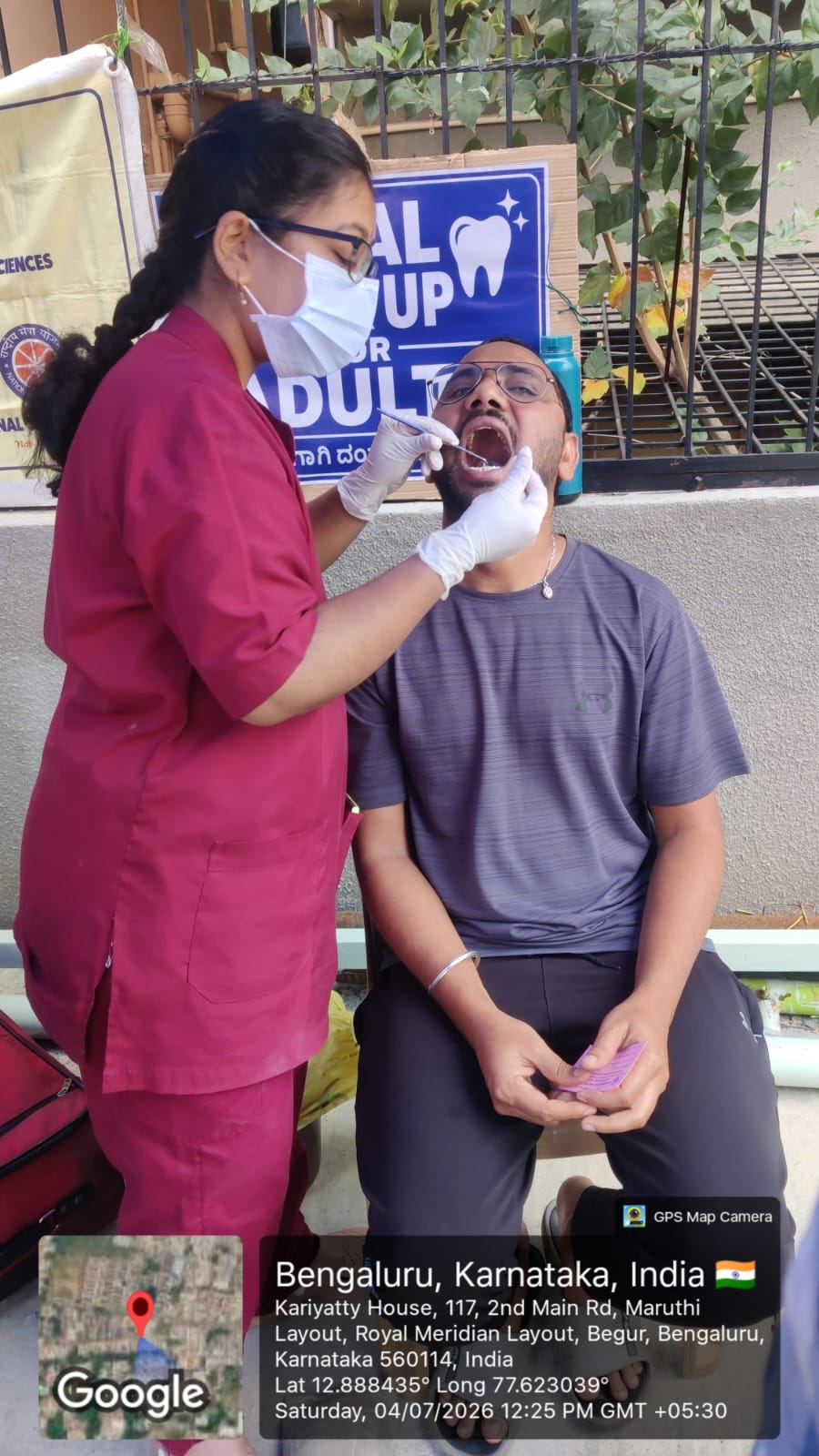 Dentist performing an oral procedure on a female patient