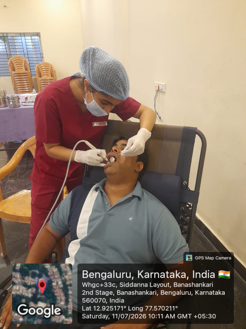 Dentist performing scaling on a patient