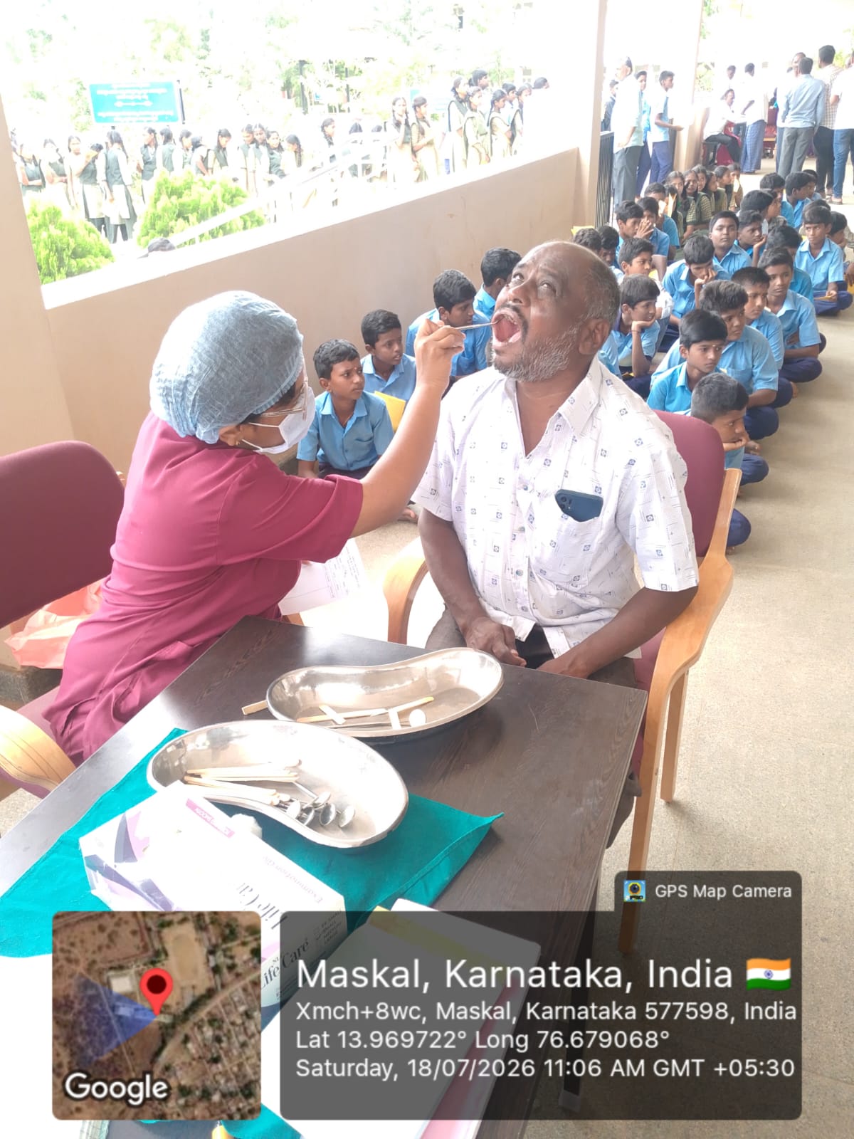 Dentist providing dental treatment to a child in a portable chair
