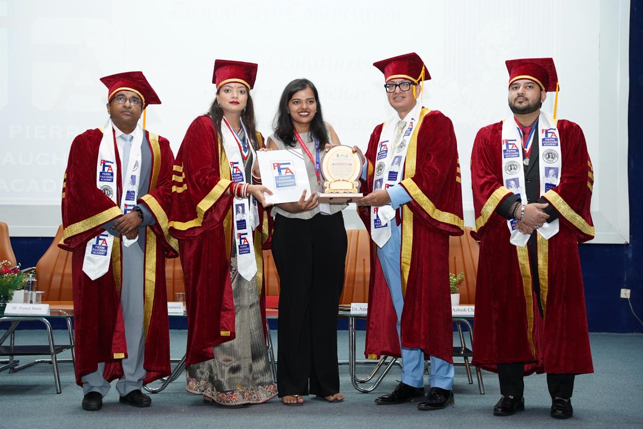 Certificate and trophy awarded to Astha for Oral Health Awareness Reel Making Competition