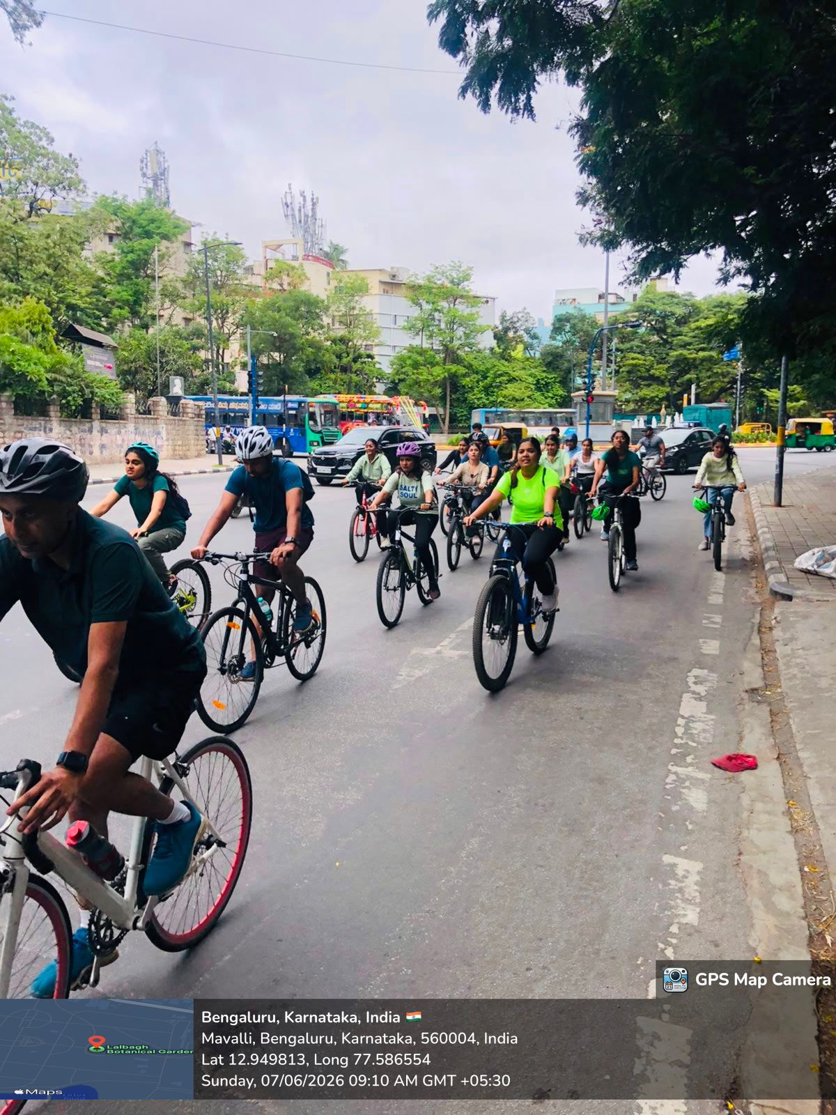 Cyclathon participants holding environmental awareness posters in front of Vidhan Soudha