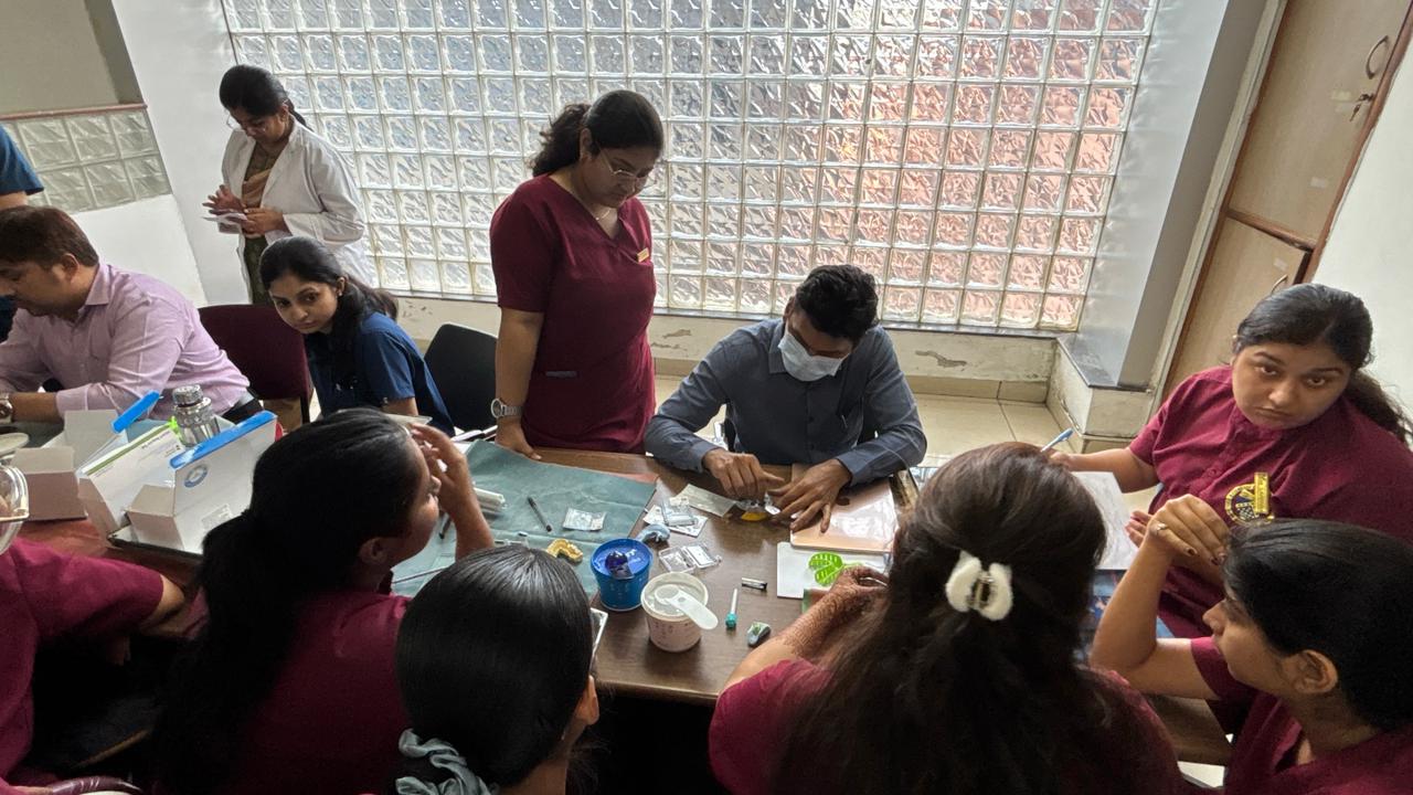 Delegates practicing implant component assembly and impression making