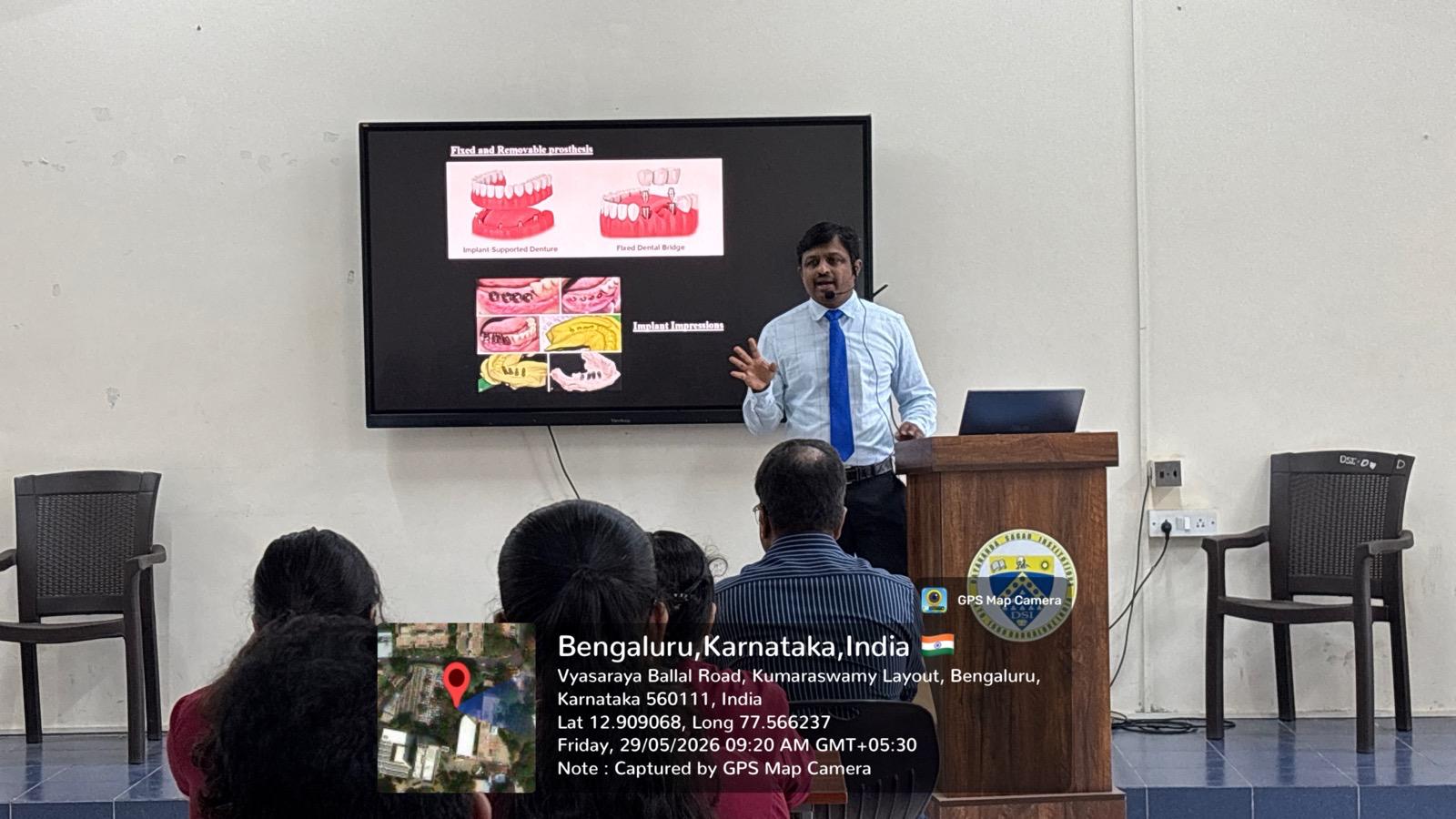 Dr. P. Roshan Kumar delivering a lecture on implant impression techniques