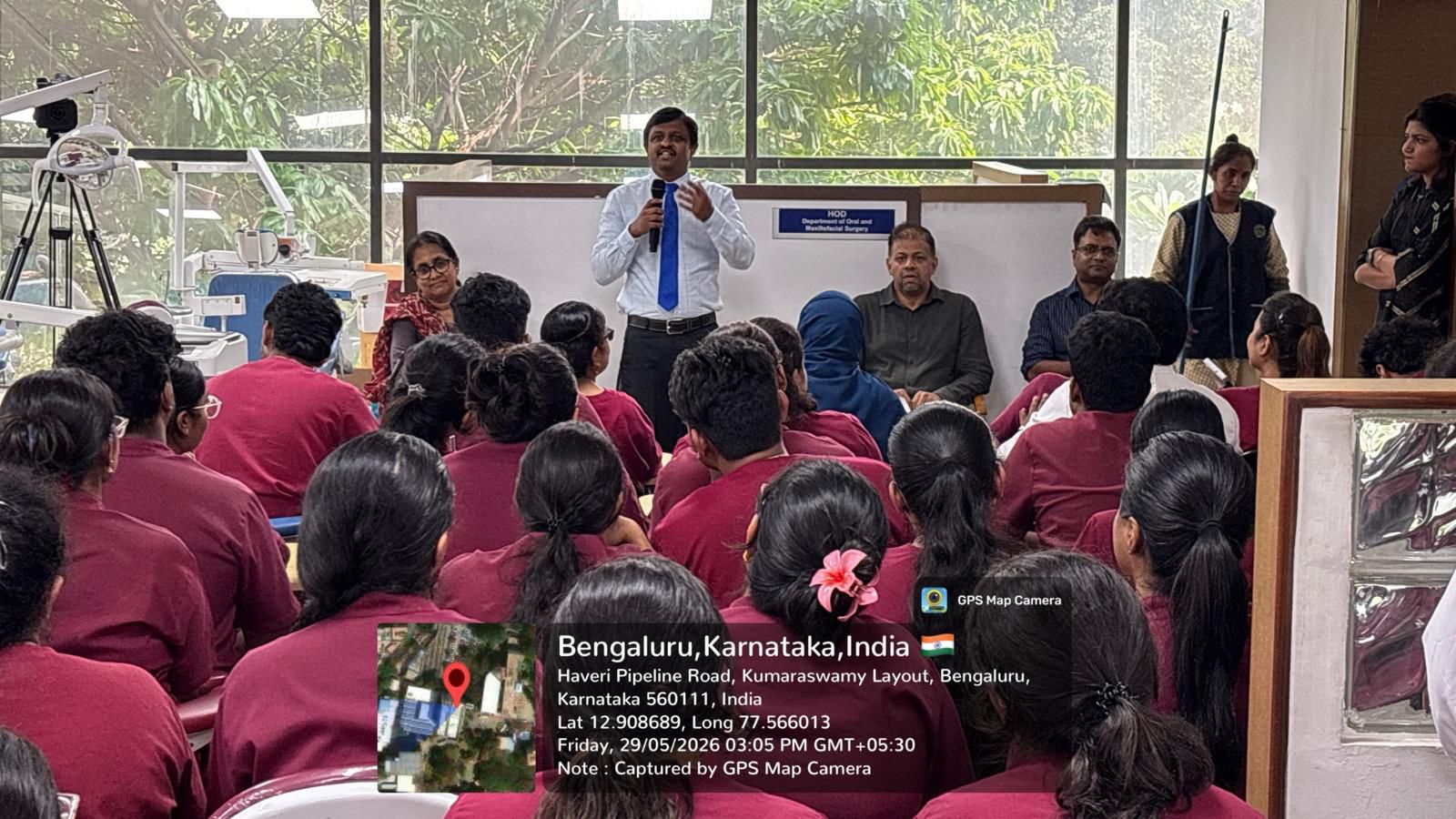 Dr. P. Roshan Kumar leading a discussion and demonstration on implant impression techniques