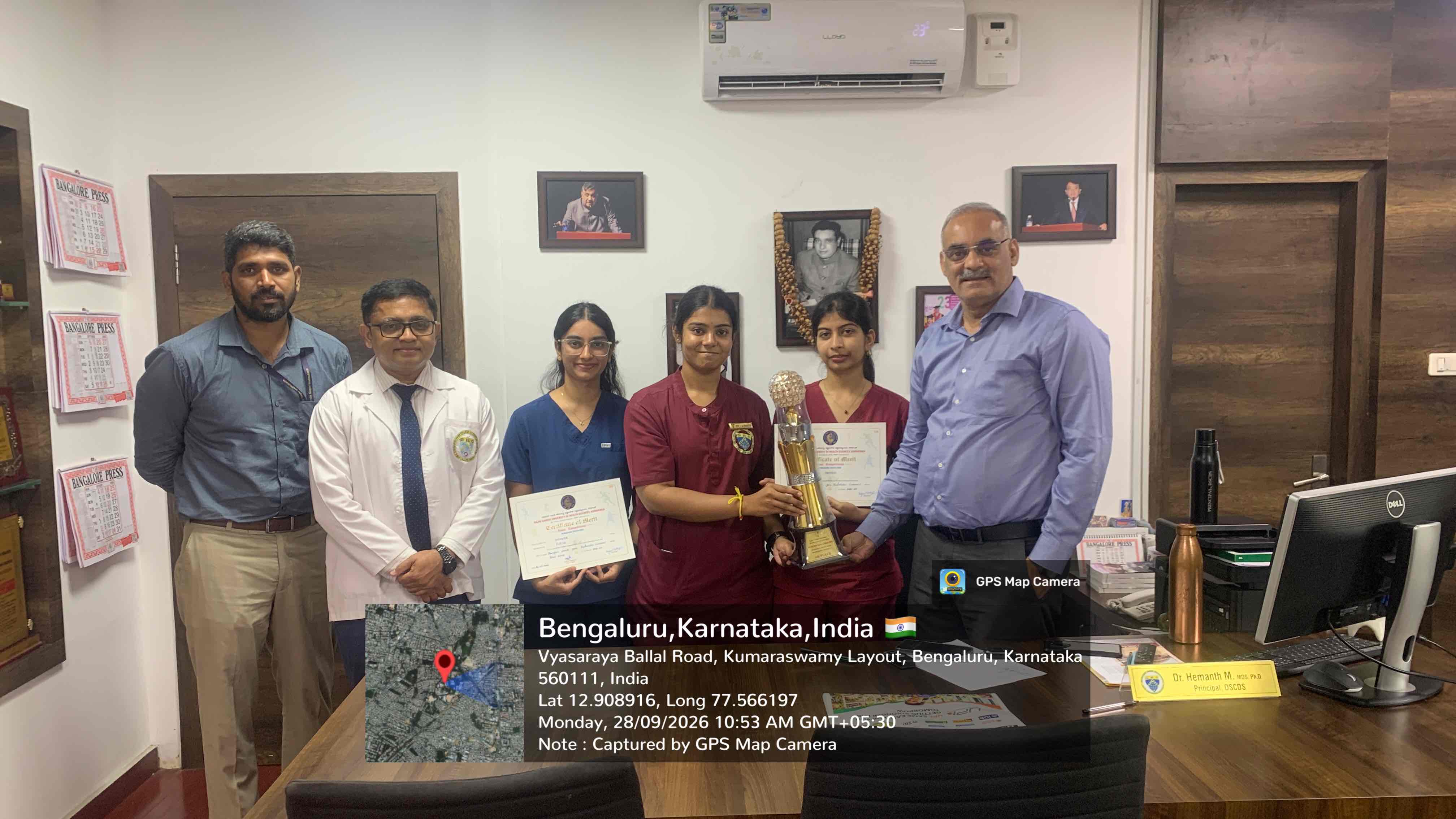 DSCDS Women's Badminton team presenting trophy to the Principal and Physical Education Director